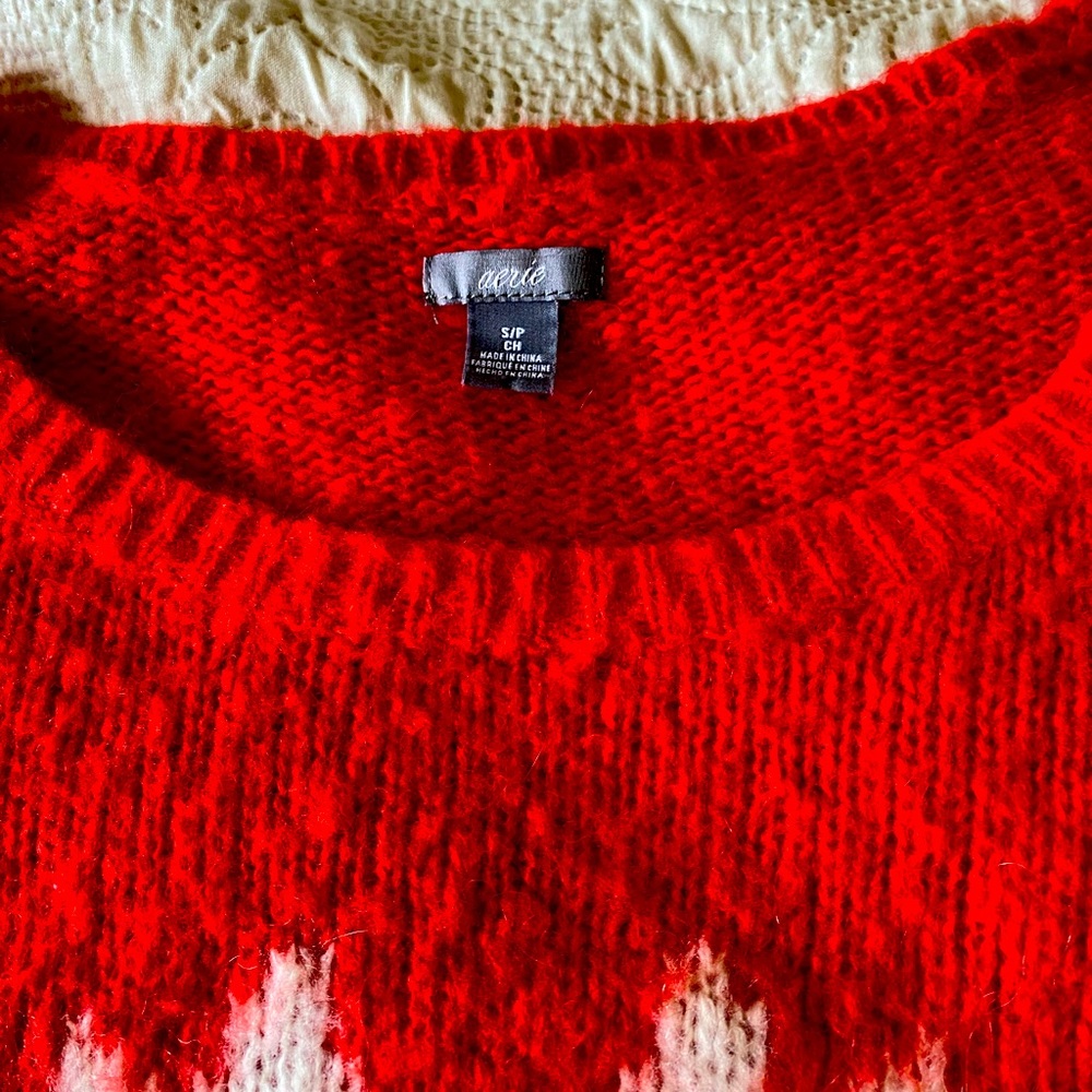 Red/orange oversized sweater with two foxes